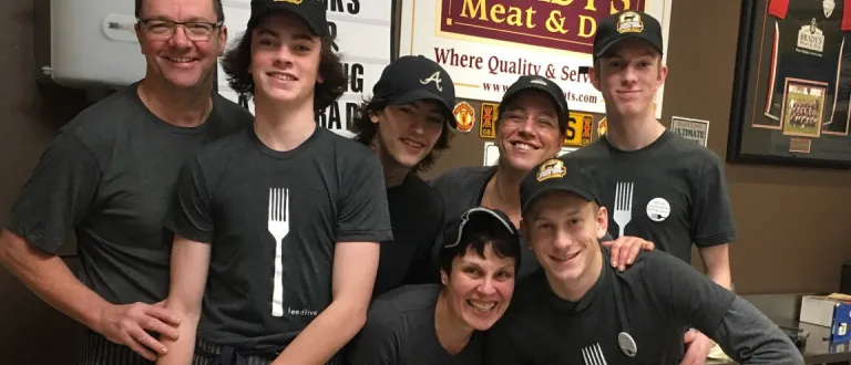 The Bradys staff wearing Feed Five t-shirts