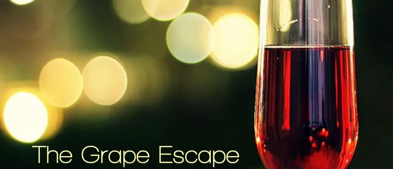 A flute glass of wine with the caption "The Grape Escape"