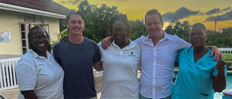 Rob Brady with several staff at Aberdeen Villa, Jamaica 